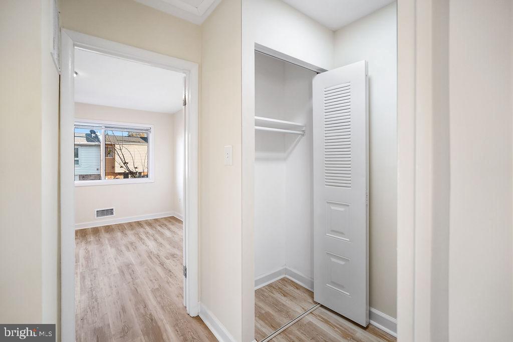 2201 Chamblee Place Herndon, VA 20170 - Photo 24 of 31 a view of an empty room with closet and wooden floor