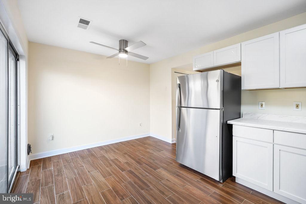 2201 Chamblee Place Herndon, VA 20170 - Photo 8 of 31 a view of a kitchen with wooden floor and electronic appliances