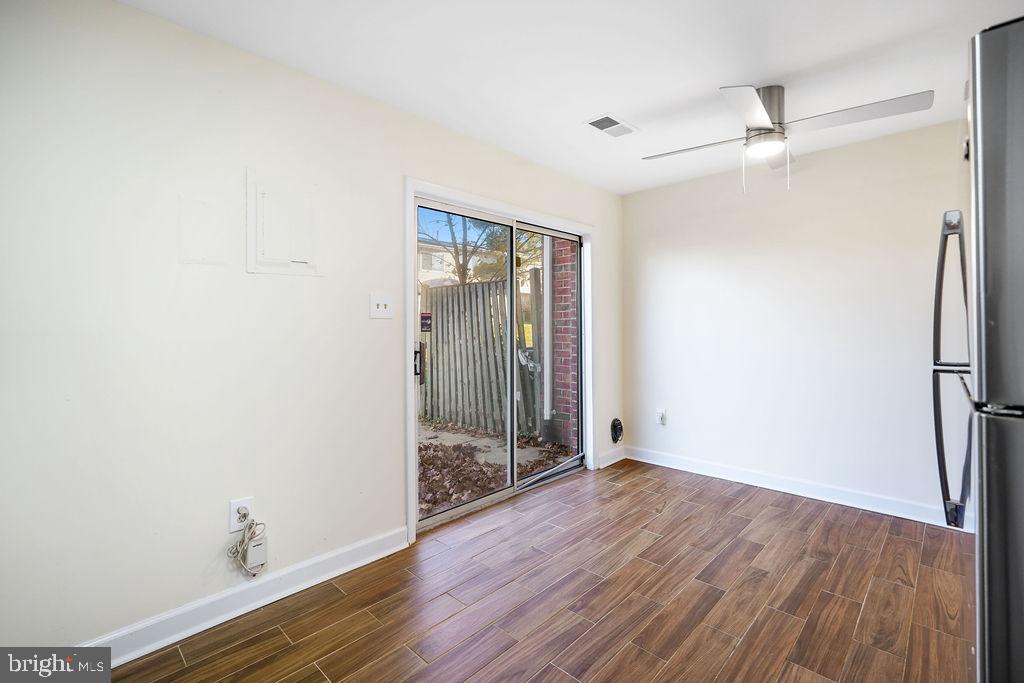 2201 Chamblee Place Herndon, VA 20170 - Photo 9 of 31 an empty room with wooden floor and a ceiling fan
