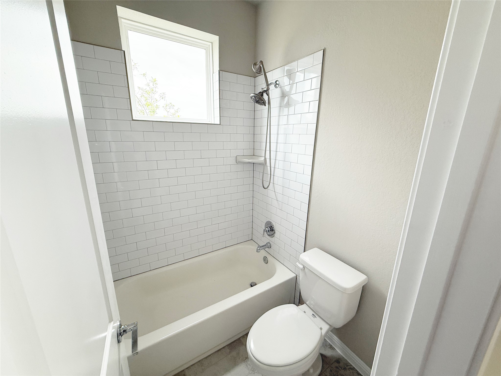 9015 Cattle Baron Path, Unit 605 Austin, TX 78747 - Photo 6 of 20 Bathroom featuring toilet and tub / shower combination