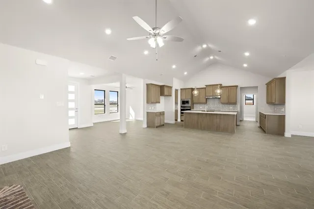 a view of a kitchen with a sink and cabinets