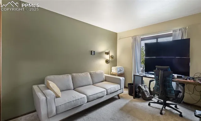 a bathroom with a granite countertop sink a mirror and shower