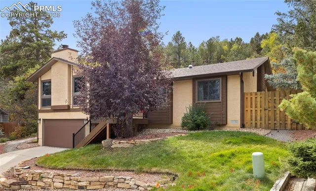 a view of a house with a yard