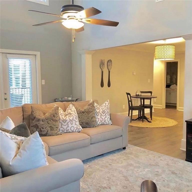 535 Forrest Avenue Gainesville, GA 30501 - Photo 3 of 6 a living room with furniture and a large window