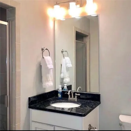 a bathroom with a sink and a mirror