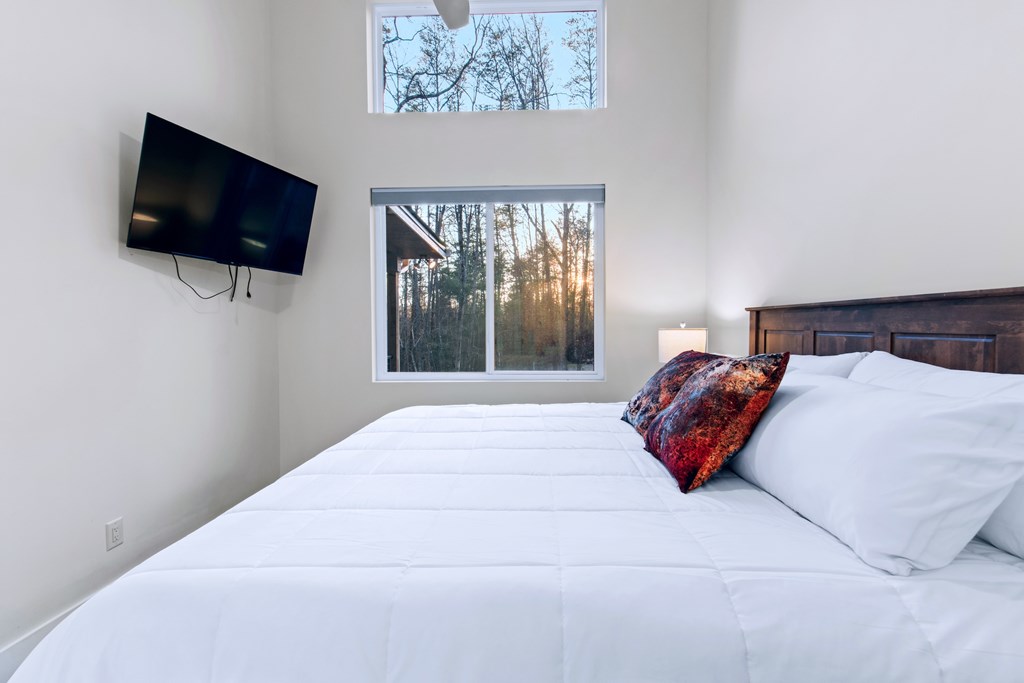 1001 Sunset Road Epworth, GA 30541 - Photo 29 of 36 a bedroom with a bed and a flat screen tv