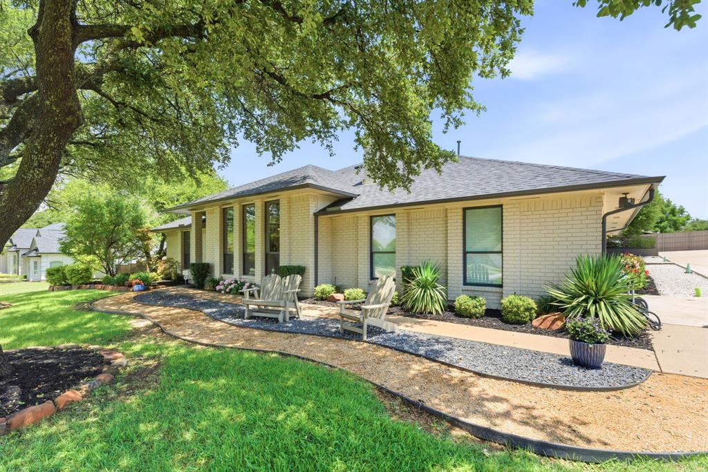 10390 Ridgecrest Street Frisco, TX 75033 - Photo 9 of 40 a front view of a house with garden