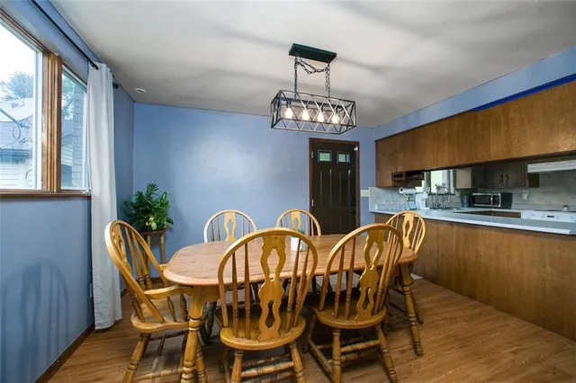 a view of a dining room with furniture window and outside view