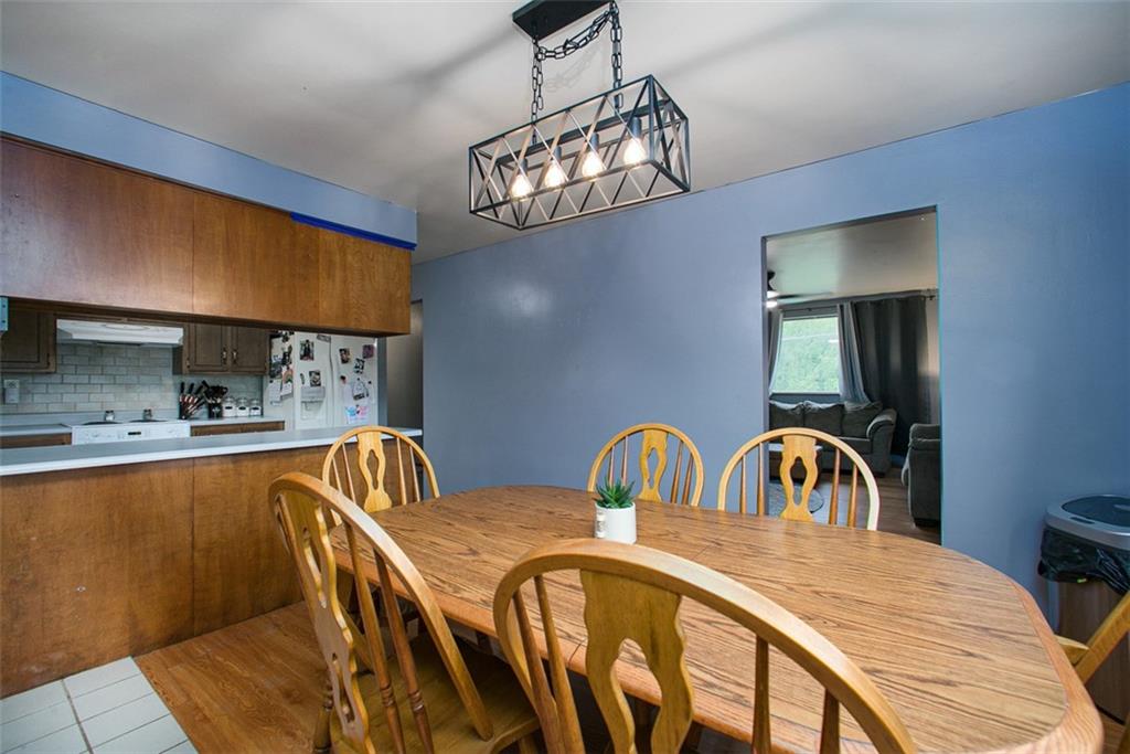 512 Leckrone-Highhouse Road McClellandtown, PA 15458 - Photo 14 of 34 a view of a dining room with furniture and chandelier