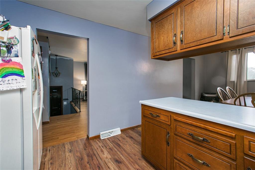 512 Leckrone-Highhouse Road McClellandtown, PA 15458 - Photo 17 of 34 a kitchen with wooden floor and cabinets