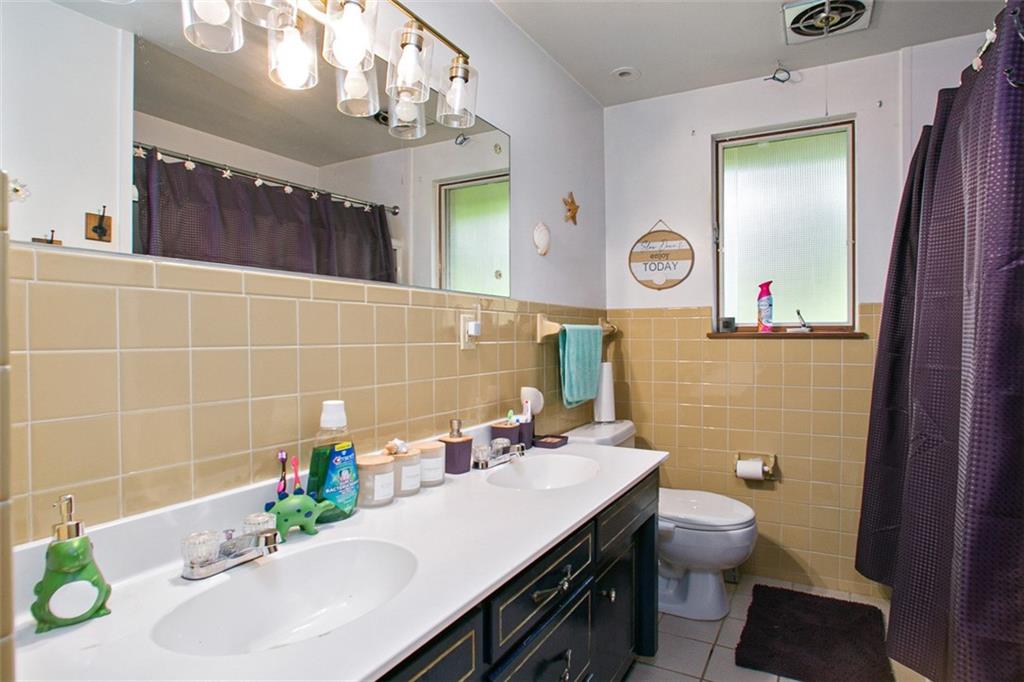 512 Leckrone-Highhouse Road McClellandtown, PA 15458 - Photo 19 of 34 a bathroom with a sink a toilet and mirror