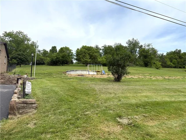 a fire hydrant in the middle of a field