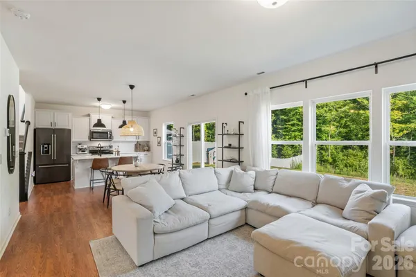 a living room with furniture and a large window