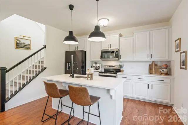 a view of a dining room and a table and chairs