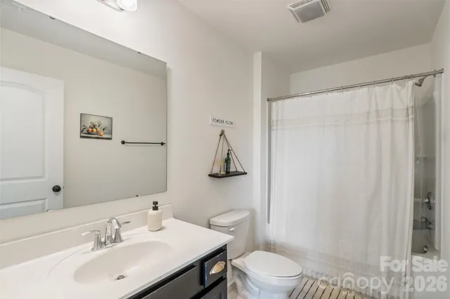 a bedroom with a bed closet and a window