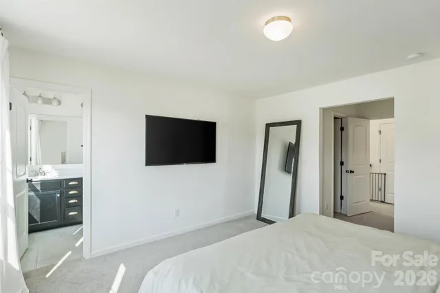 a bathroom with a granite countertop sink toilet a mirror and shower