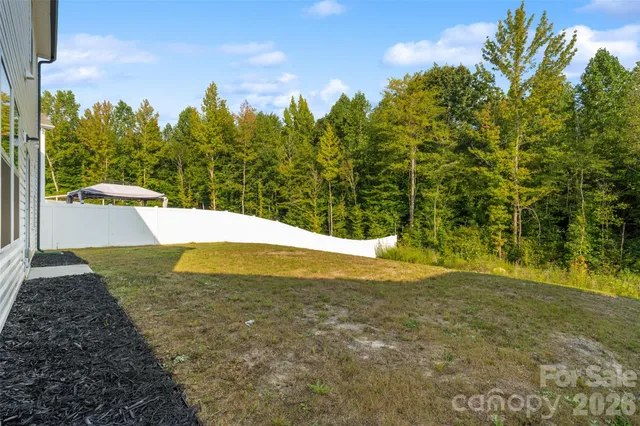a swimming pool with wooden fence