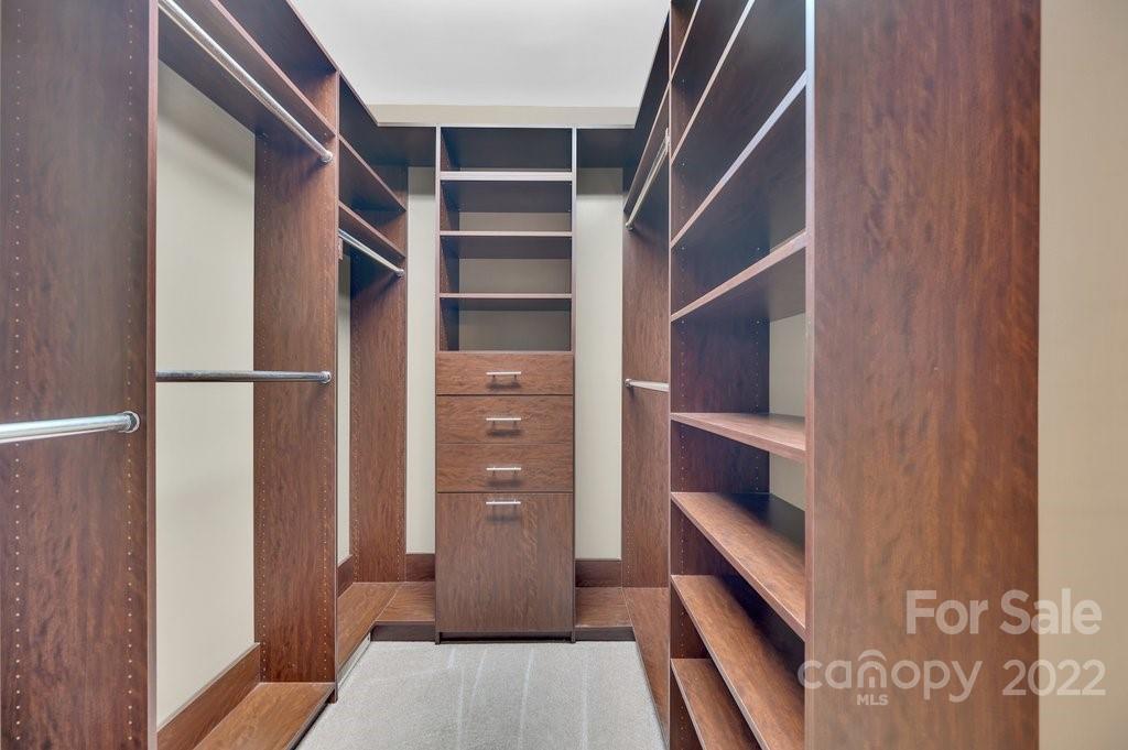 656 Amberly Crossing Fort Mill, SC 29708 - Photo 17 of 44 a view of walk in closet with empty racks