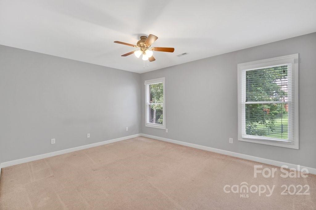 656 Amberly Crossing Fort Mill, SC 29708 - Photo 21 of 44 an empty room with windows and fan