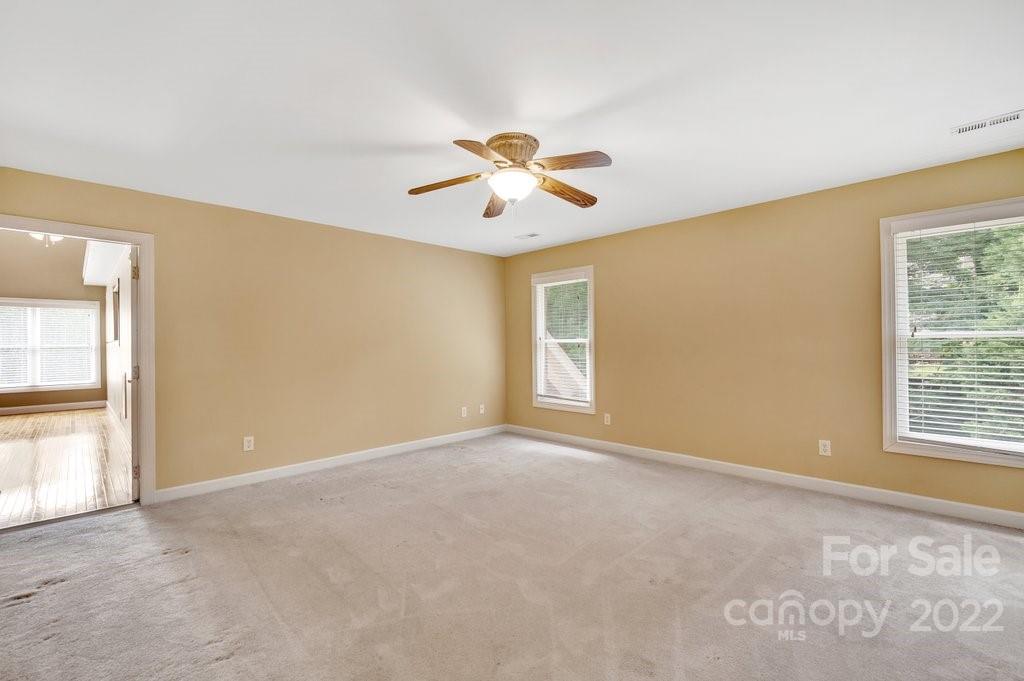 656 Amberly Crossing Fort Mill, SC 29708 - Photo 23 of 44 a view of a room with a ceiling fan and a window