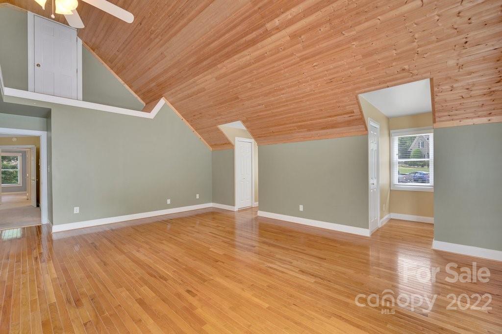 656 Amberly Crossing Fort Mill, SC 29708 - Photo 26 of 44 a view of an empty room with wooden floor and a window