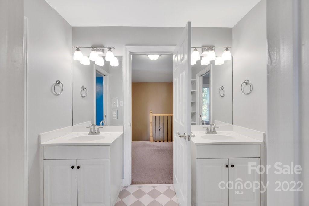 656 Amberly Crossing Fort Mill, SC 29708 - Photo 28 of 44 a bathroom with a double vanity sink mirror and shower