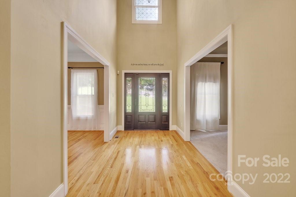656 Amberly Crossing Fort Mill, SC 29708 - Photo 3 of 44 a view of an empty room with wooden floor and a window
