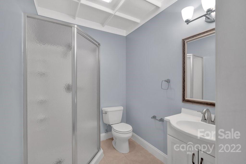 656 Amberly Crossing Fort Mill, SC 29708 - Photo 36 of 44 a bathroom with a toilet a sink and mirror