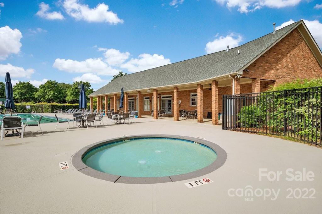 656 Amberly Crossing Fort Mill, SC 29708 - Photo 42 of 44 a view of a house with swimming pool and sitting area
