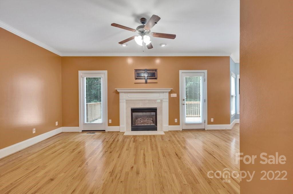 656 Amberly Crossing Fort Mill, SC 29708 - Photo 7 of 44 a view of an empty room with a fireplace and a window