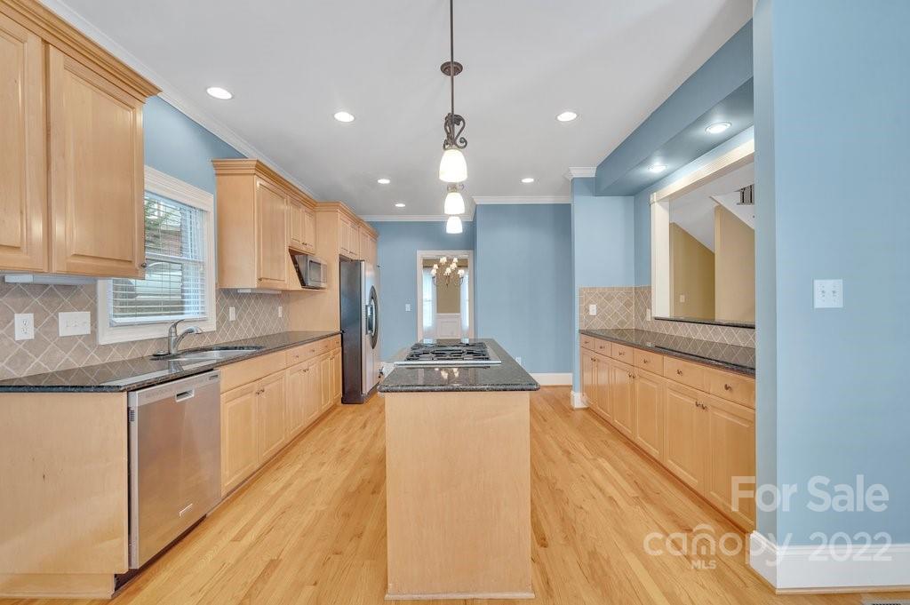 656 Amberly Crossing Fort Mill, SC 29708 - Photo 10 of 44 a kitchen with stainless steel appliances granite countertop a sink and cabinets