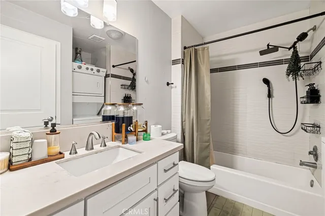 a bedroom with two beds and a couch