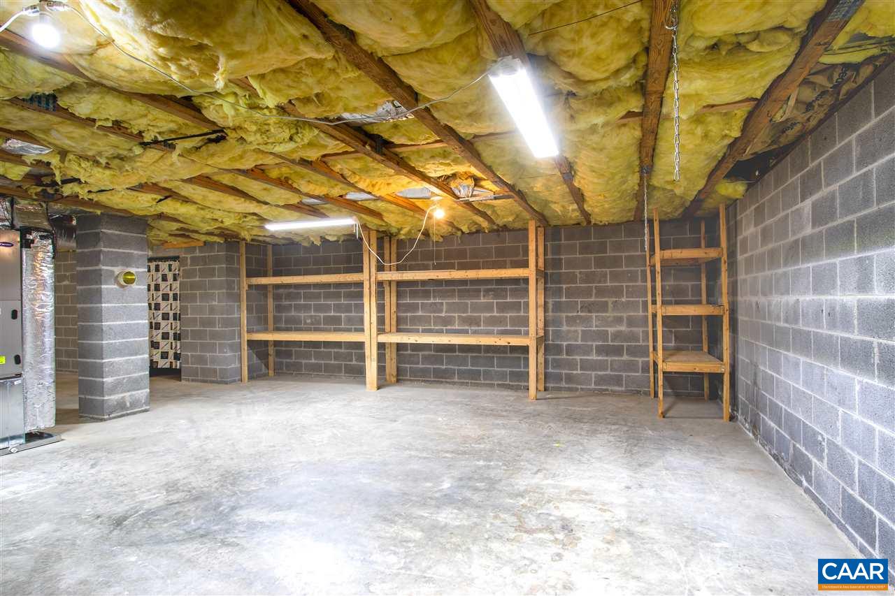 29 Narcissus Road Ruckersville, VA 22968 - Photo 21 of 26 a view of an empty room with a brick wall
