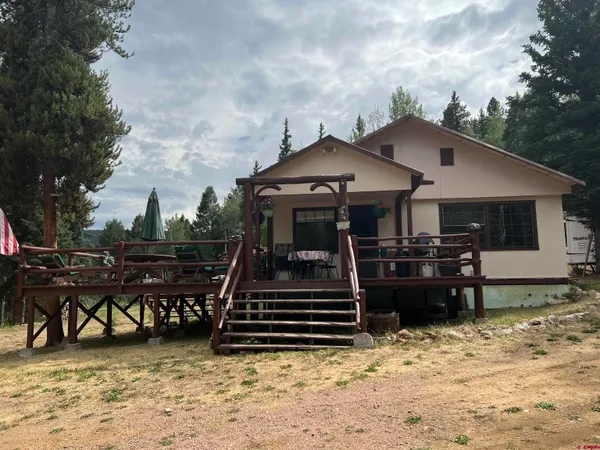 a view of a house with chairs in patio