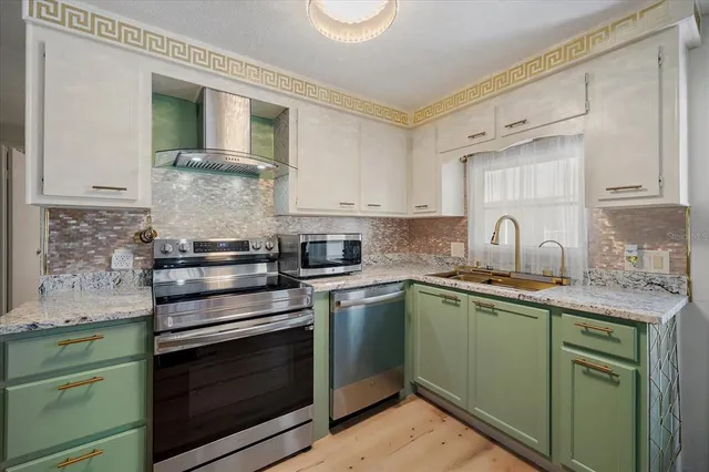 a kitchen with a stove and a sink