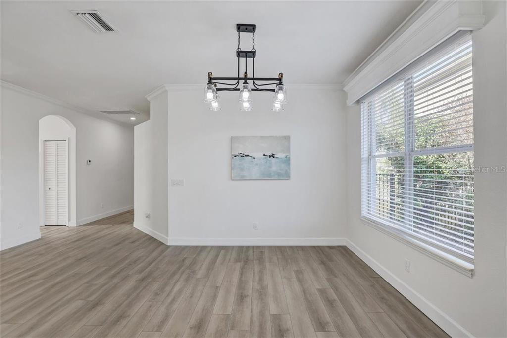 4006 91st Avenue East Parrish, FL 34219 - Photo 12 of 48 wooden floor in an empty room with a window