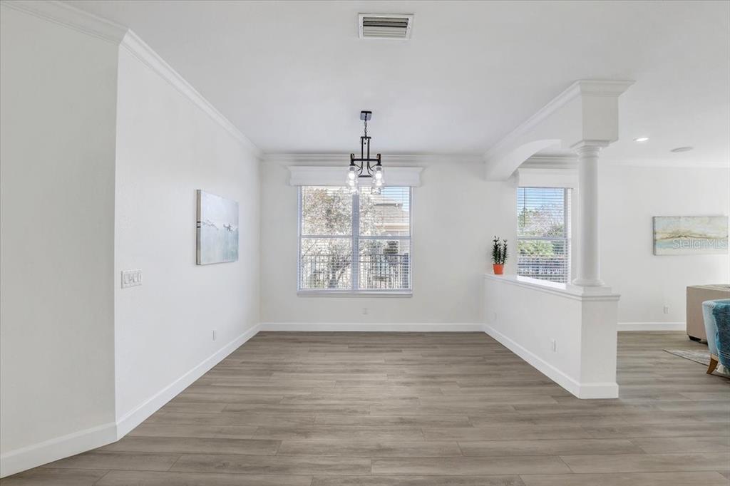 4006 91st Avenue East Parrish, FL 34219 - Photo 14 of 48 a view of an empty room with wooden floor and a window