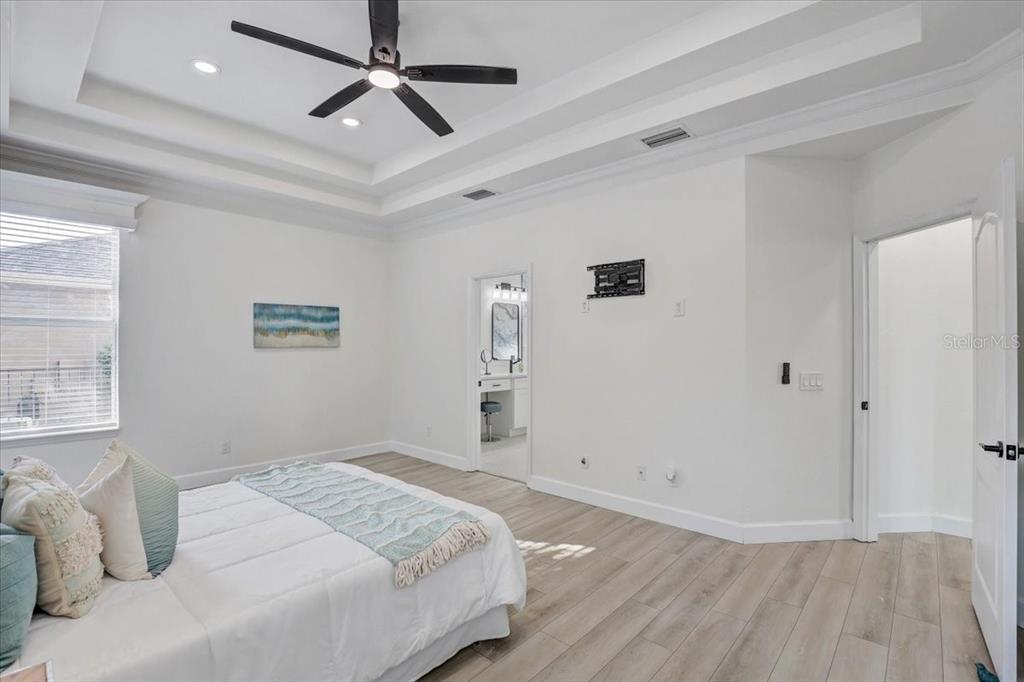 4006 91st Avenue East Parrish, FL 34219 - Photo 21 of 48 a bedroom with a bed and a window