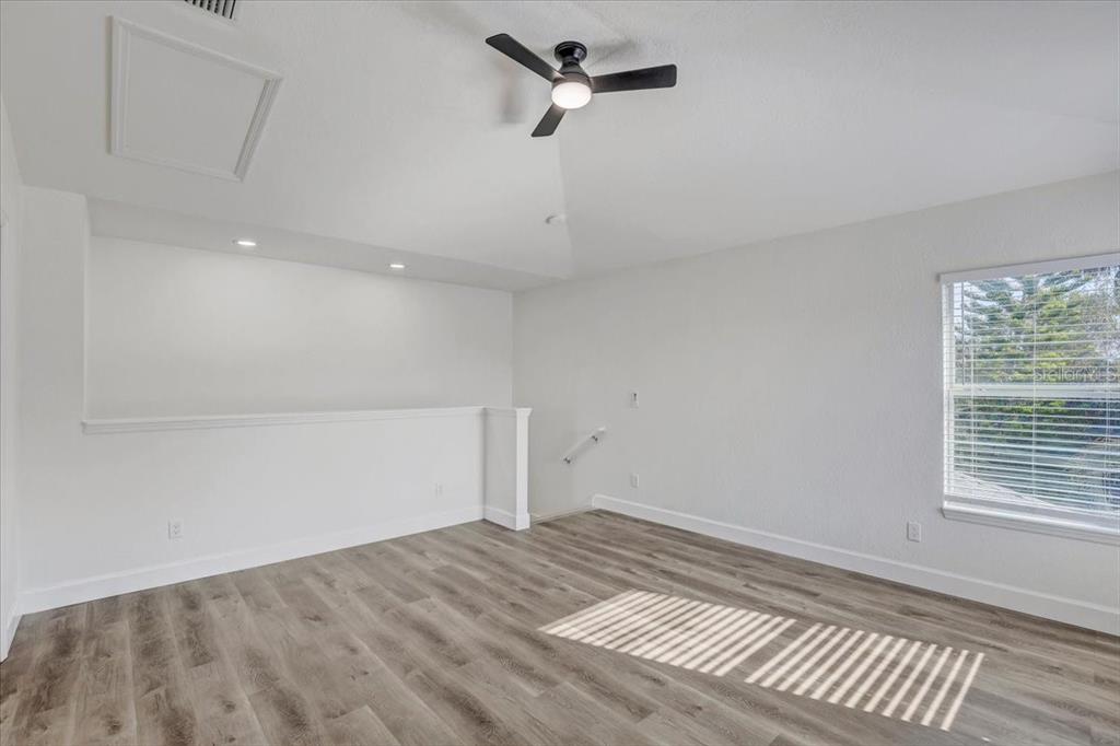 4006 91st Avenue East Parrish, FL 34219 - Photo 32 of 48 wooden floor in an empty room with a window