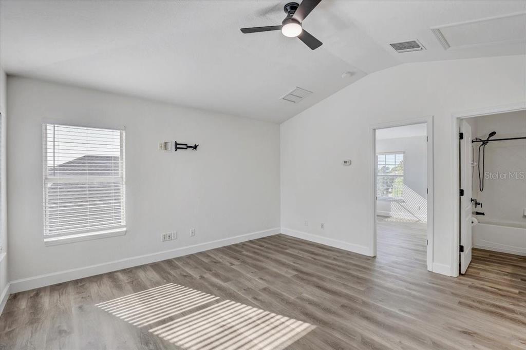 4006 91st Avenue East Parrish, FL 34219 - Photo 33 of 48 wooden floor in an empty room with a window