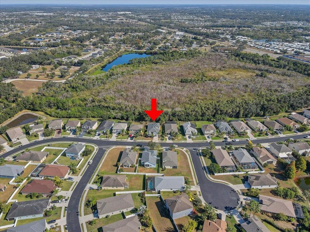 4006 91st Avenue East Parrish, FL 34219 - Photo 42 of 48 an aerial view of residential houses with outdoor space