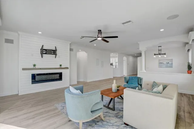 a living room with furniture and a fireplace