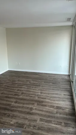 a view of room with wooden floor