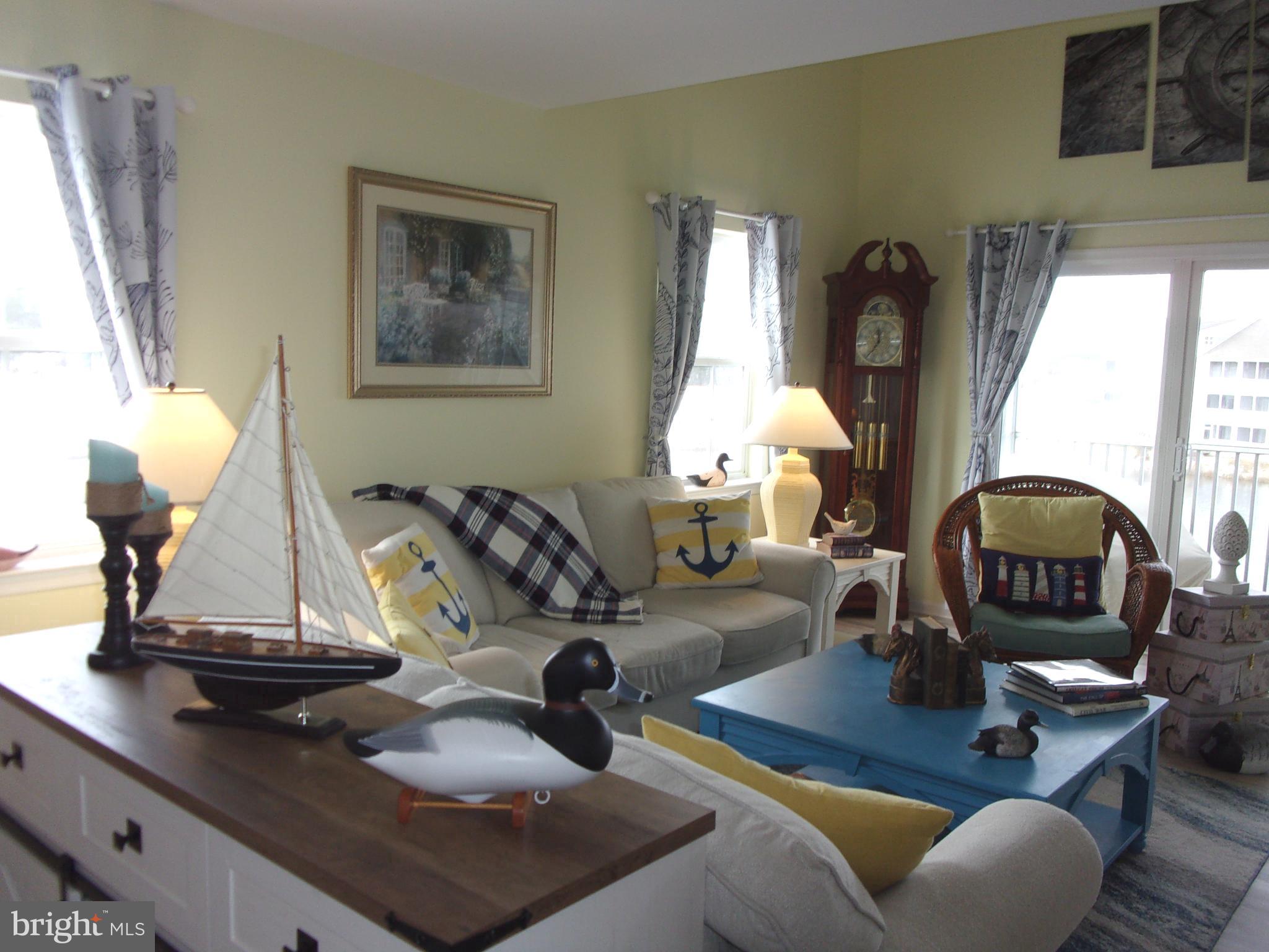 30397 Pavilion Drive, Unit 105 Ocean View, DE 19970 - Photo 14 of 34 Bright living room with side windows