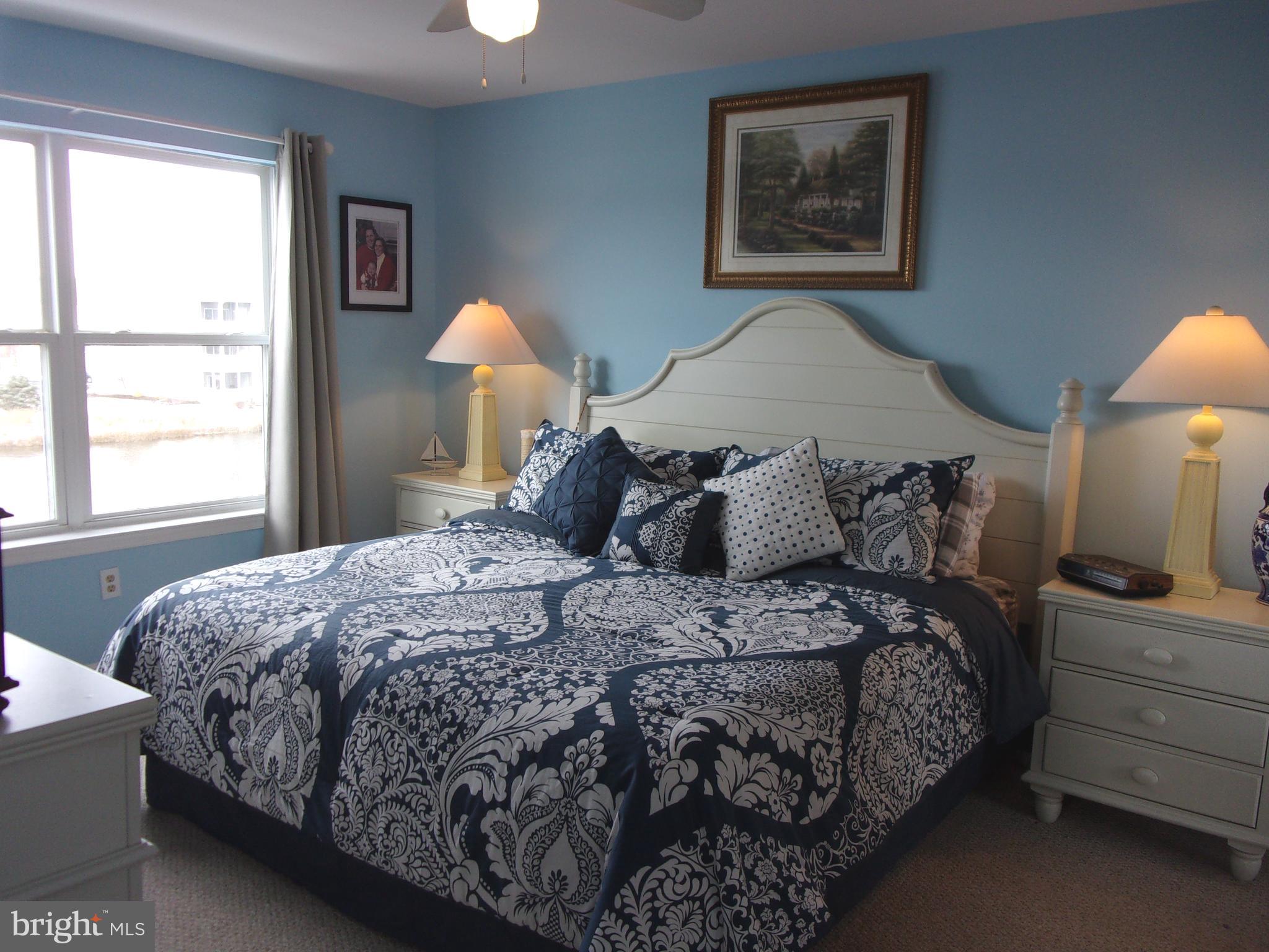 30397 Pavilion Drive, Unit 105 Ocean View, DE 19970 - Photo 16 of 34 Master bedroom with king bed
