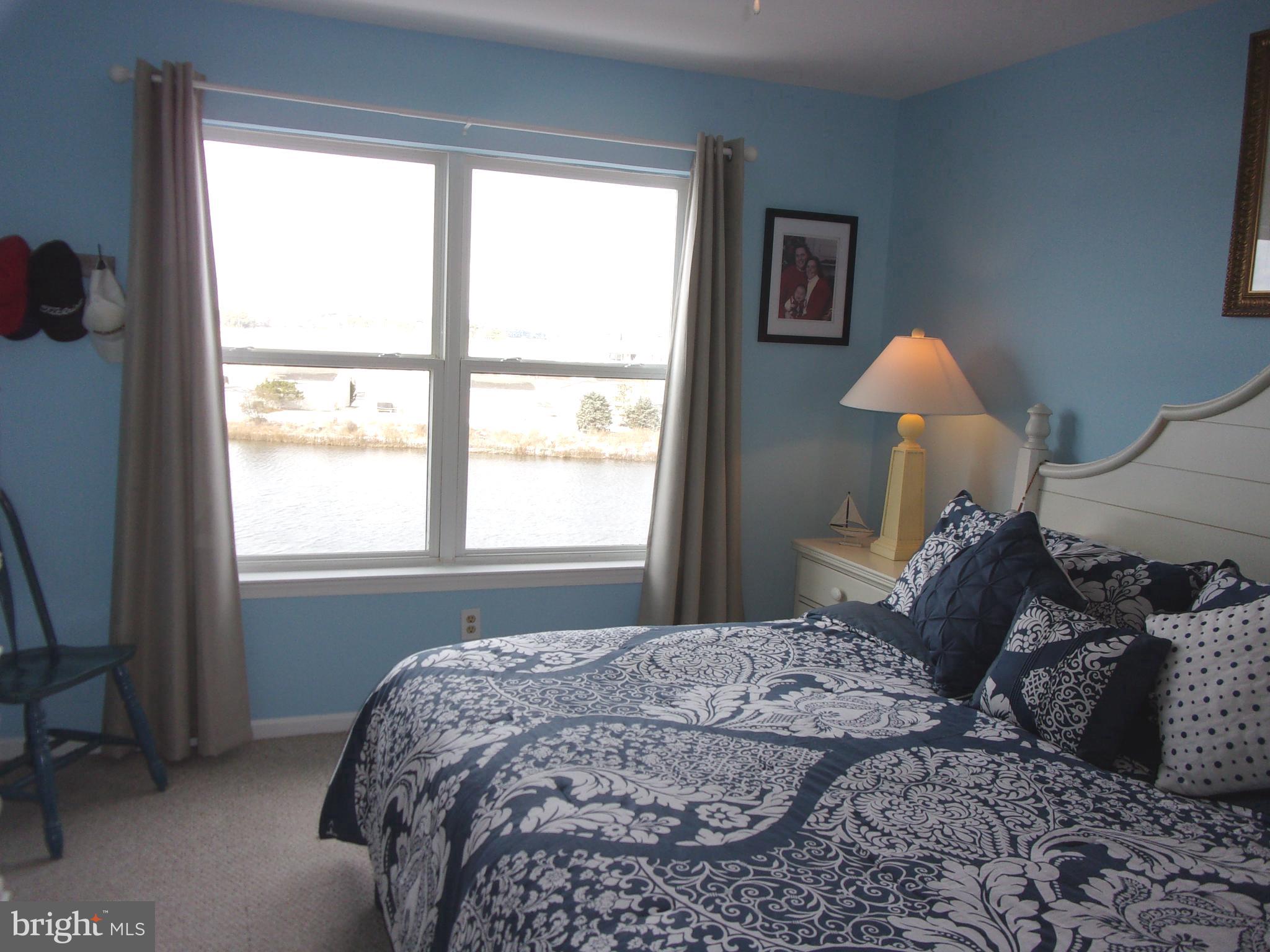30397 Pavilion Drive, Unit 105 Ocean View, DE 19970 - Photo 17 of 34 Master bedroom overlooking pond