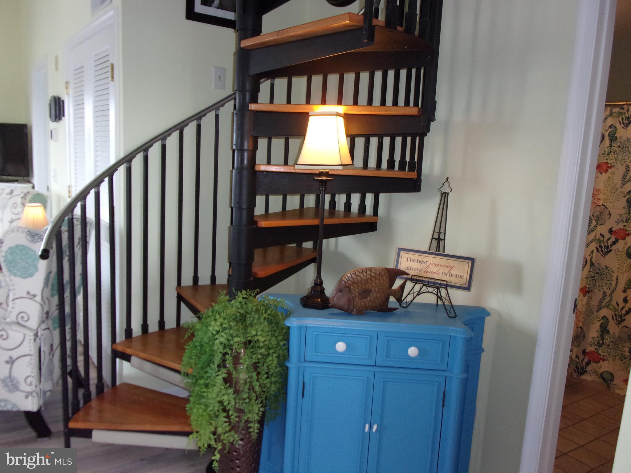 30397 Pavilion Drive, Unit 105 Ocean View, DE 19970 - Photo 21 of 34 Spiral staircase to 2nd level
