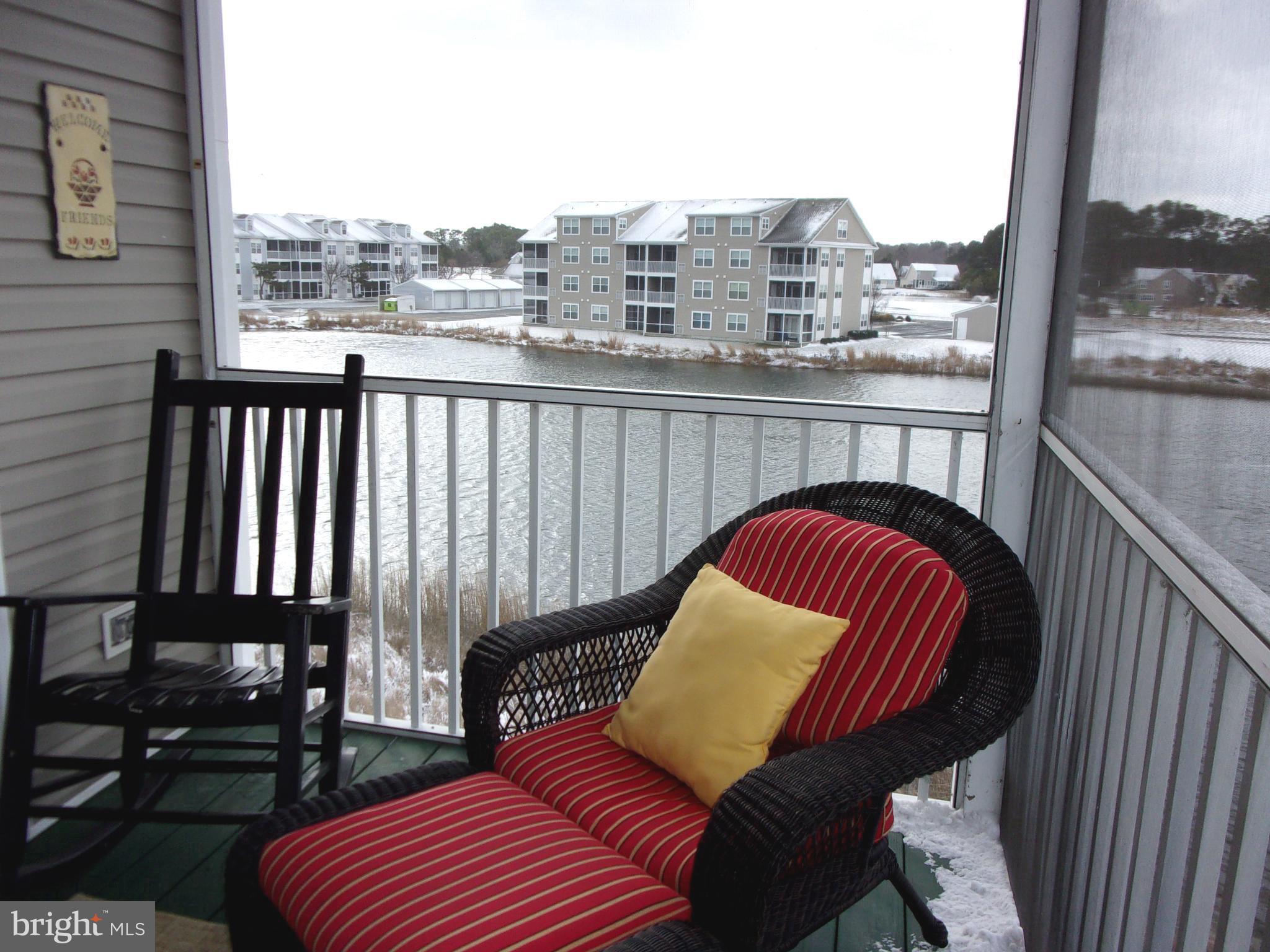 30397 Pavilion Drive, Unit 105 Ocean View, DE 19970 - Photo 28 of 34 Screened porch overlooking pond & water feature