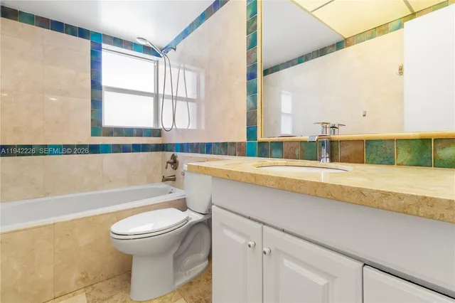 a bathroom with a sink a toilet and a bathtub