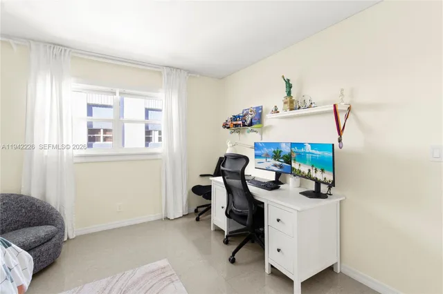 a view of workspace with furniture and window